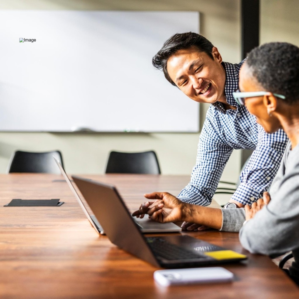 Colleagues collaborating on an AI transformation project